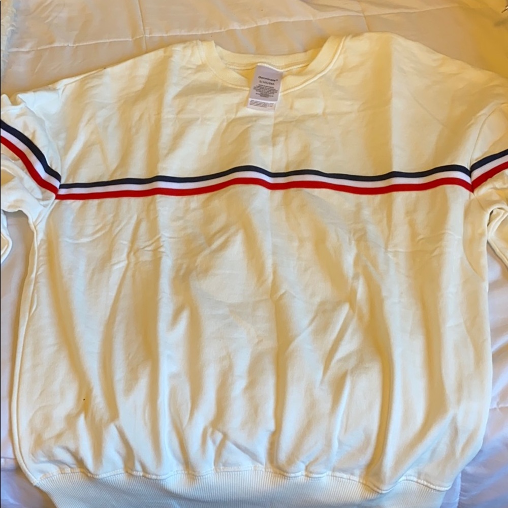 White crew neck with red white and blue stripes.